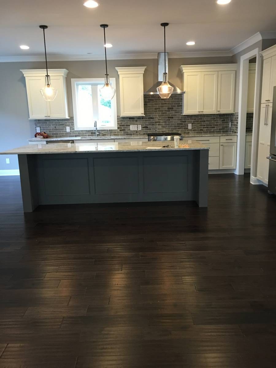 Custom kitchen remodel with modern cabinetry and stone countertops