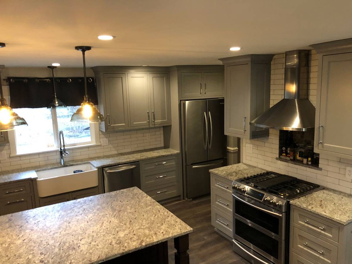 Bright kitchen remodel with shaker cabinets and designer hardware