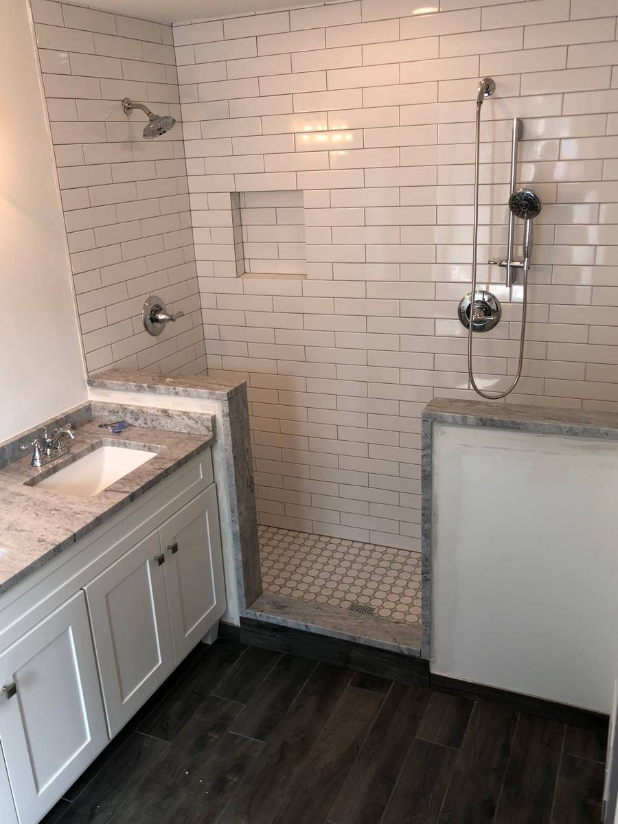Custom bathroom with designer tilework and premium fixtures