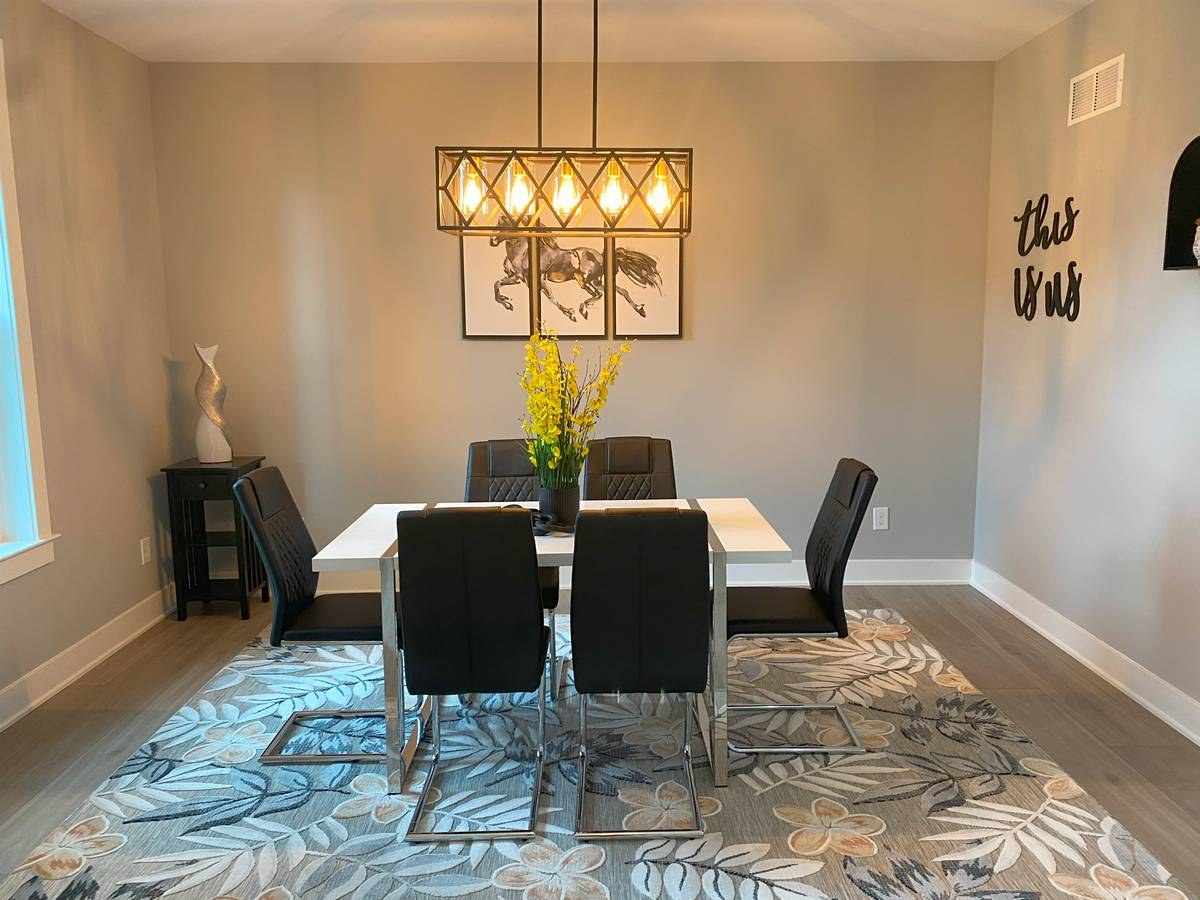 Open-plan dining and living area with high ceilings in custom new construction