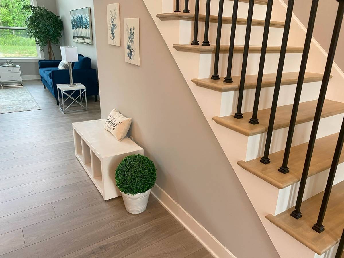 Custom new build living space with high ceilings, large windows, and premium finishes
