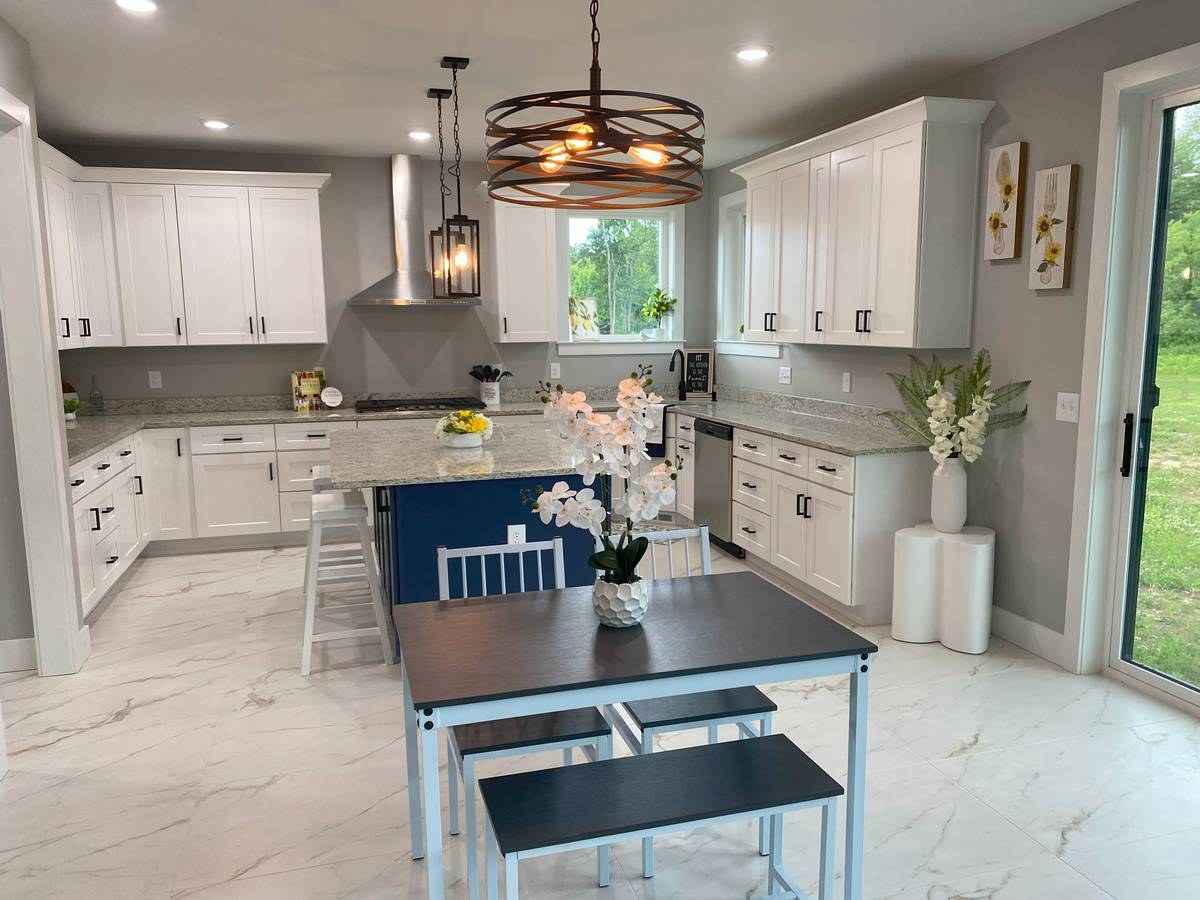 Kitchen and dining area with custom cabinetry in new construction home