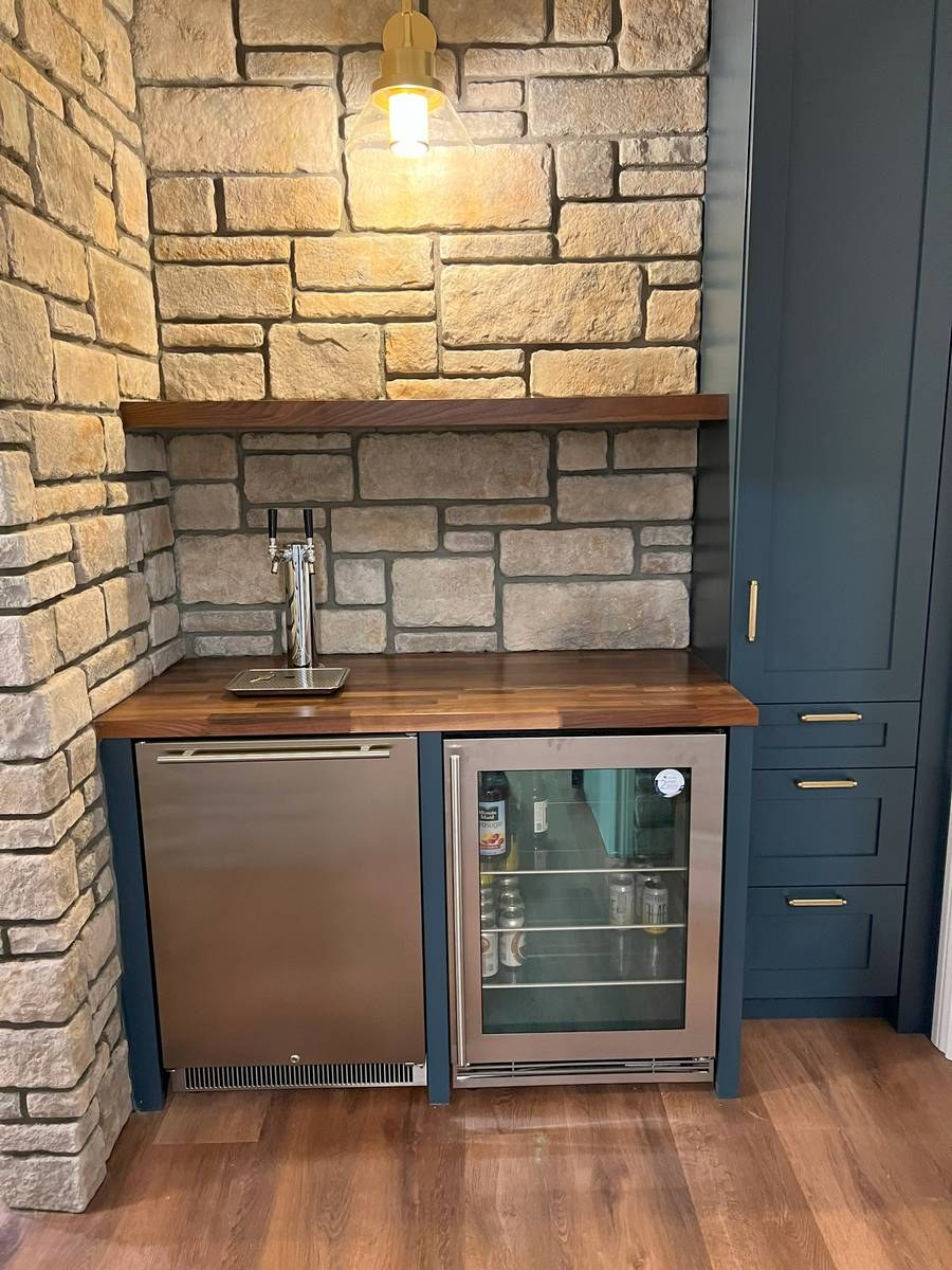 Finished basement with custom built-in cabinetry and entertainment space