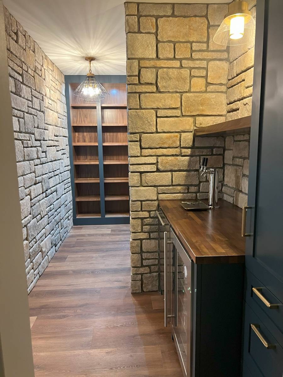 Basement build-out with storage solutions and recreational space