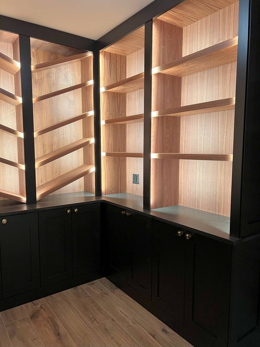 Wine cellar corner with custom cedar racking and warm ambient lighting