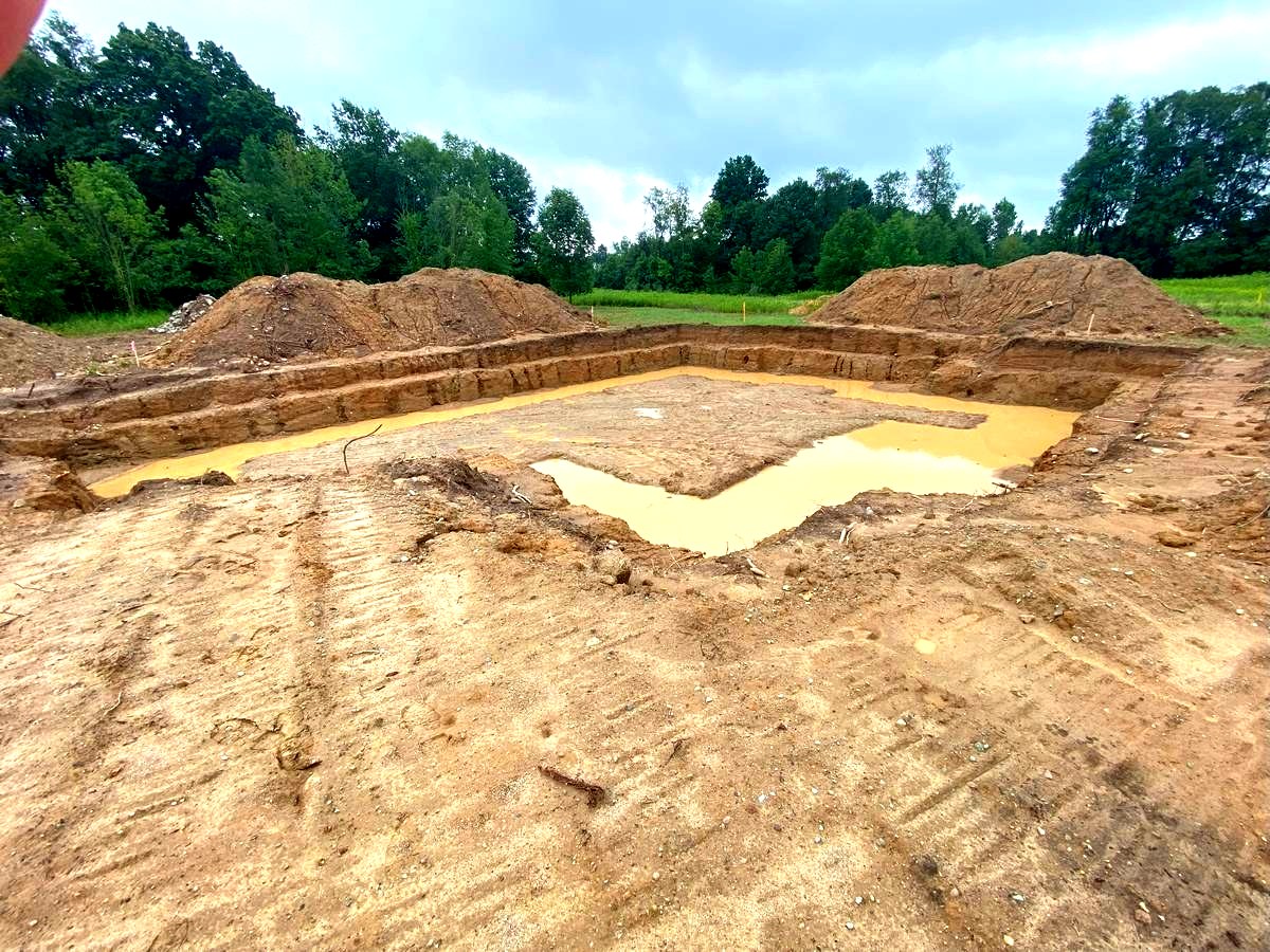 Foundation excavation with footer trench dug and forms set for custom new home