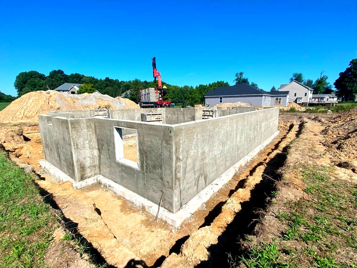 Poured concrete foundation walls and basement structure for custom new home build