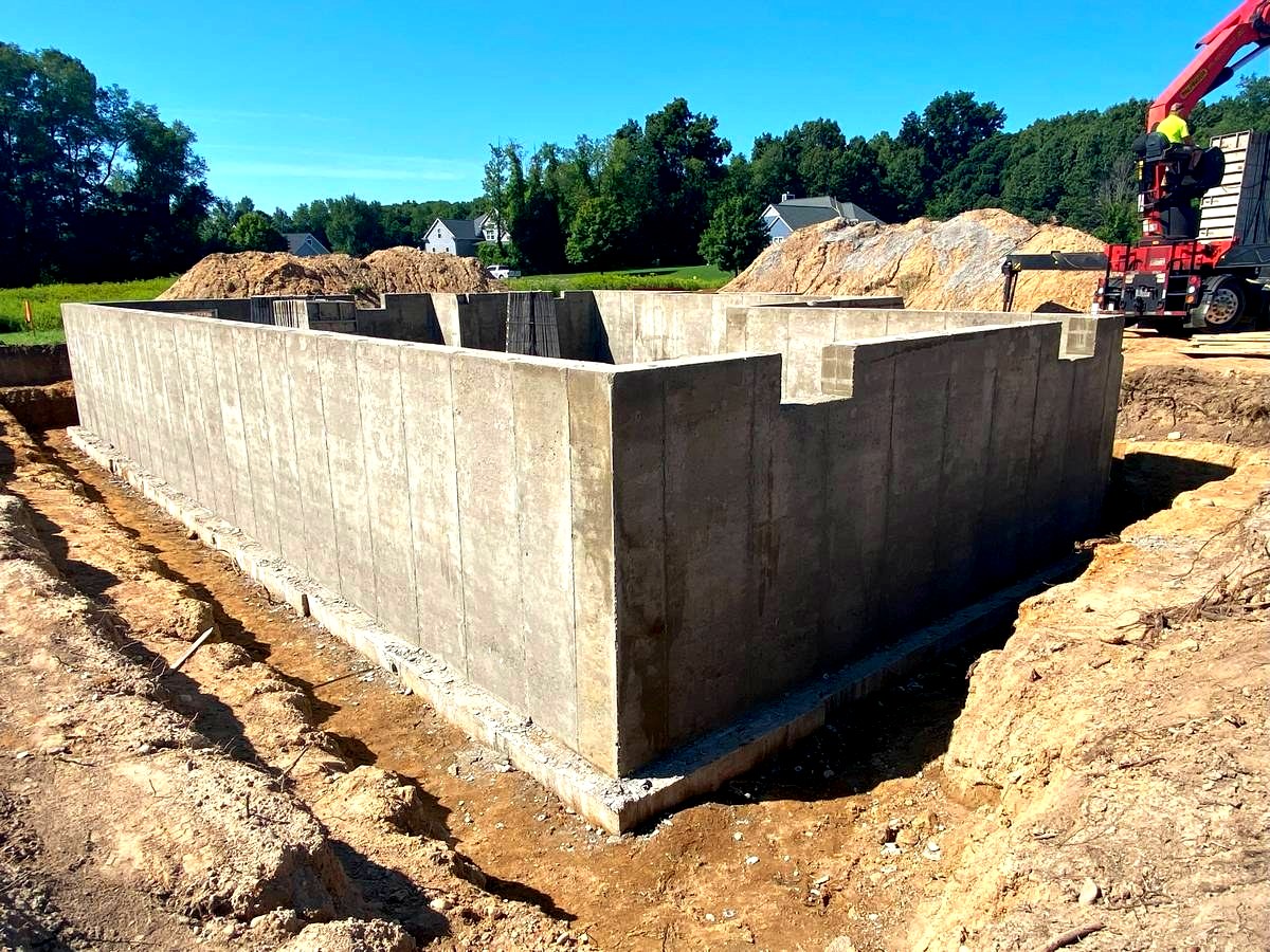 Full concrete foundation walls poured and cured, ready for framing