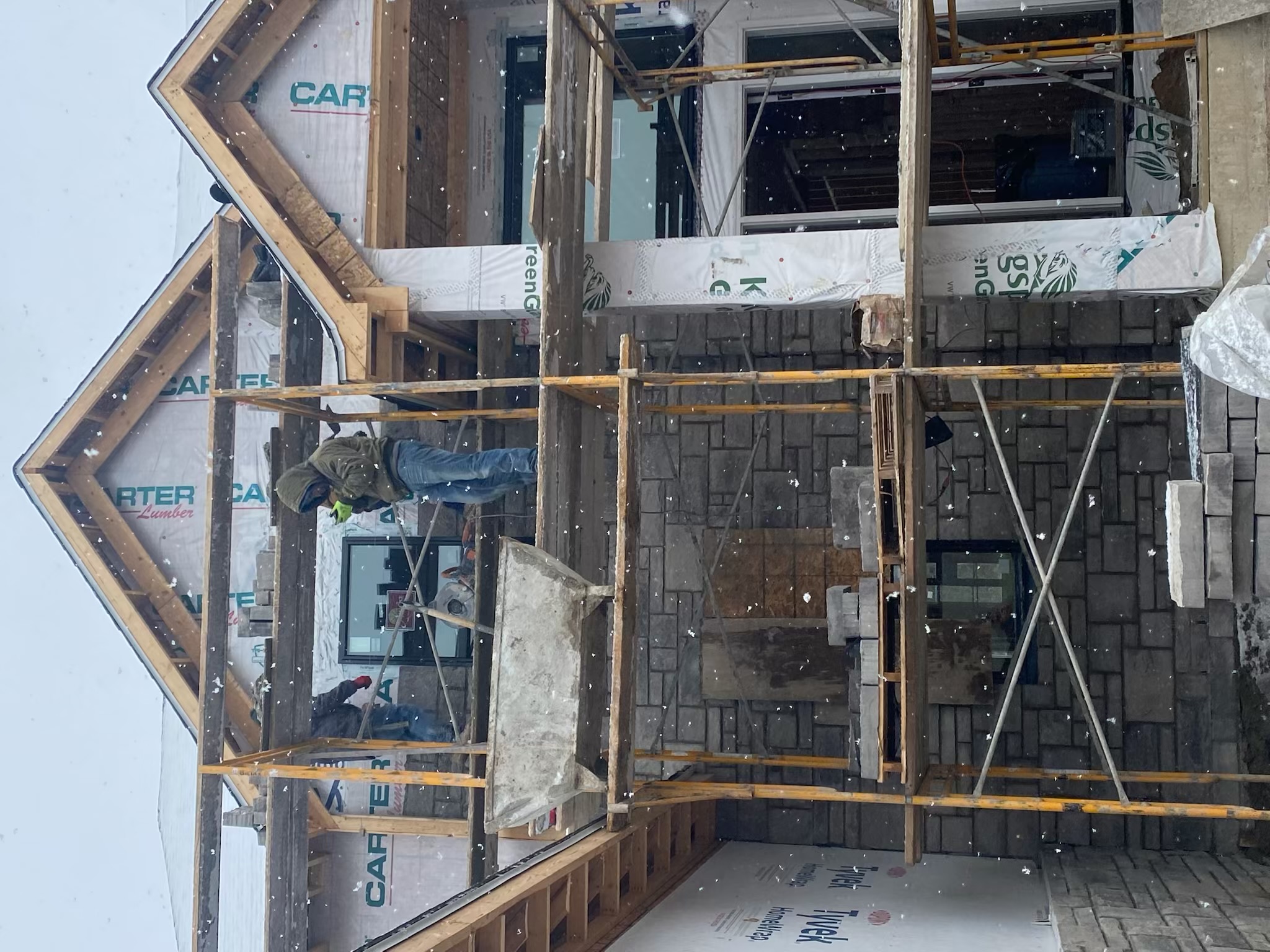 Construction crew on site during early build phase with active earthwork